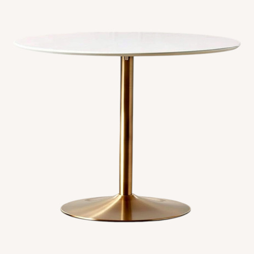 Used CB2 Odyssey Brass Dining Table for sale on AptDeco