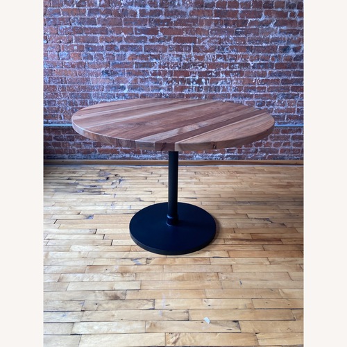 Used Natural Wood Dining Table for sale on AptDeco