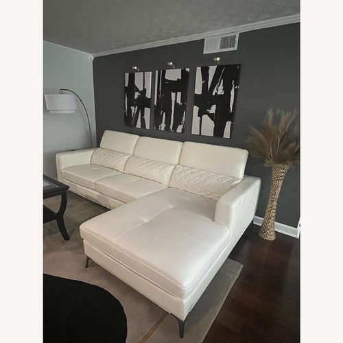 Used Rooms To Go  White Faux Leather 2 Piece Sectional for sale on AptDeco