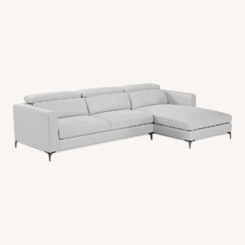 Used Rooms To Go  White Faux Leather 2 Piece Sectional for sale on AptDeco