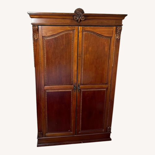 Used Dark Brown Wood Armoire for sale on AptDeco