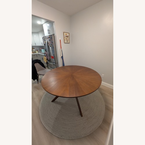 Used Article Conan Dark Brown Wood Dining Table for sale on AptDeco