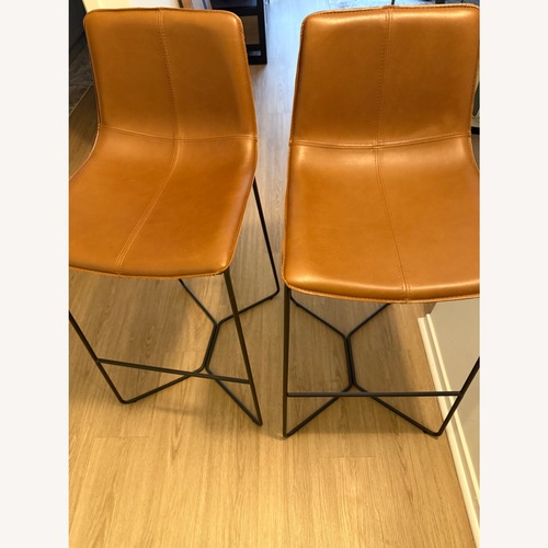 Used West Elm Slope Leather Bar Stools 2 for sale on AptDeco