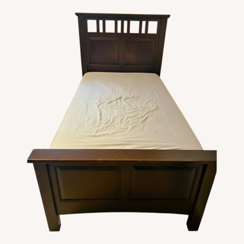 Used Dark Brown Wood Twin Bed for sale on AptDeco