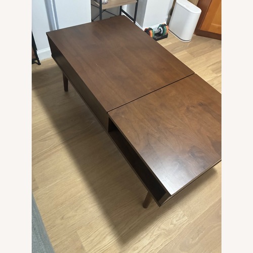 Used Bob's Discount Furniture Bettie Walnut Lift-Top Storage Coffee Table for sale on AptDeco