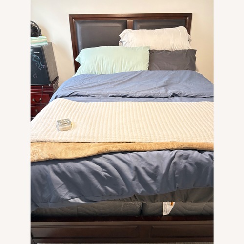 Used Dark Brown Wood Queen Bed for sale on AptDeco