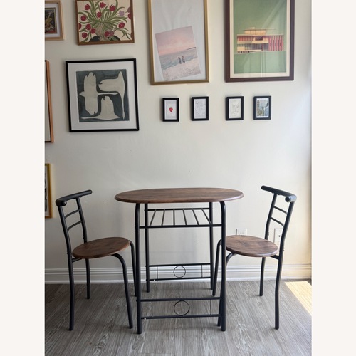 Used Amazon Black Wood Dining Set for sale on AptDeco