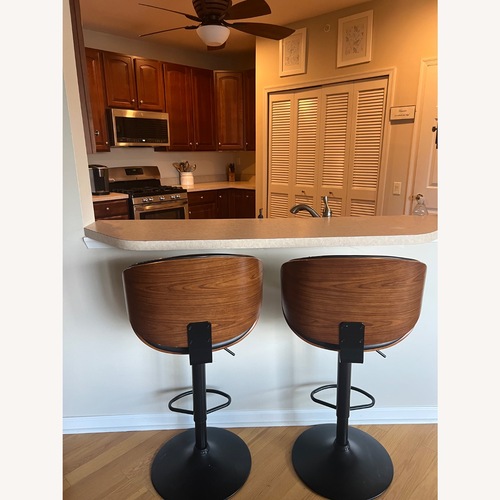 Used Modern Living Supplies Black Leather Stools for sale on AptDeco