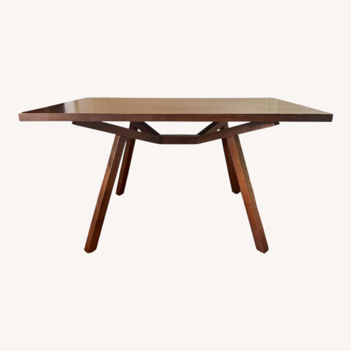 Used Dark Brown Wood Dining Table for sale on AptDeco
