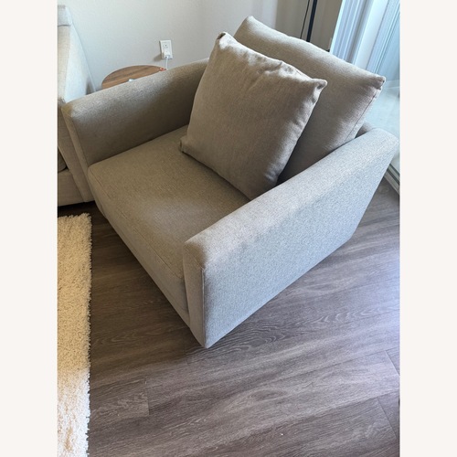 Used Crate & Barrel Lounge Light Gray Swivel Chair for sale on AptDeco