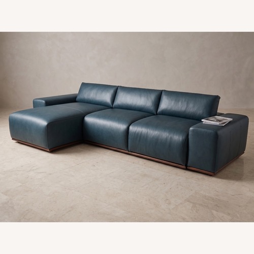 Used Floating Blue Leather Sofa With Manual Recliner for sale on AptDeco