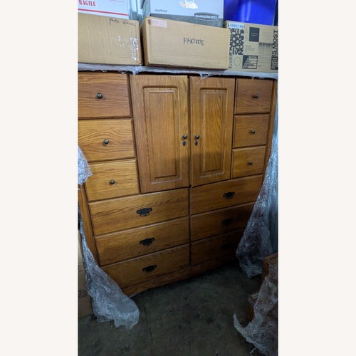 Used Medium Brown Wooden Clothing Armoire for sale on AptDeco