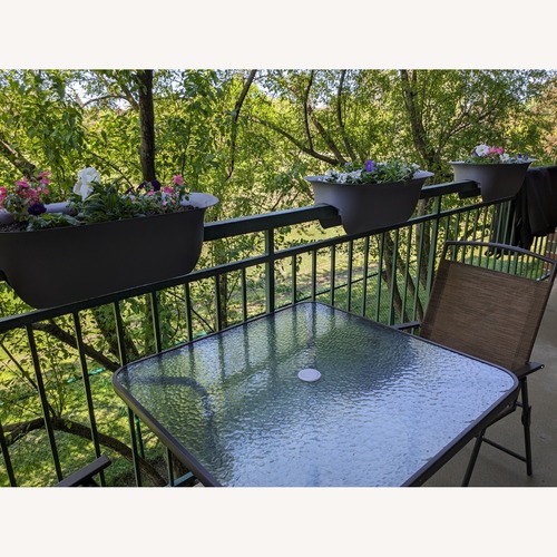 Used Glass Outdoor Dining Table and 4 Chairs for sale on AptDeco