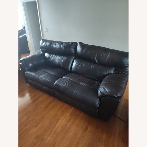 Used Chocolate Brown Leather Reclining Couch for sale on AptDeco