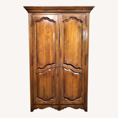 Used Vintage/Antique Finds Dark Brown Wood Armoire for sale on AptDeco