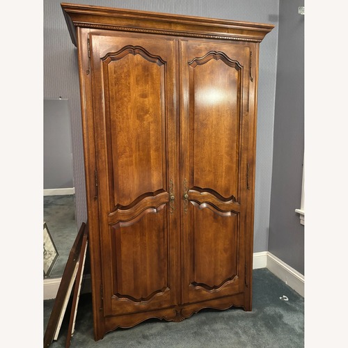 Used Vintage/Antique Finds Dark Brown Wood Armoire for sale on AptDeco