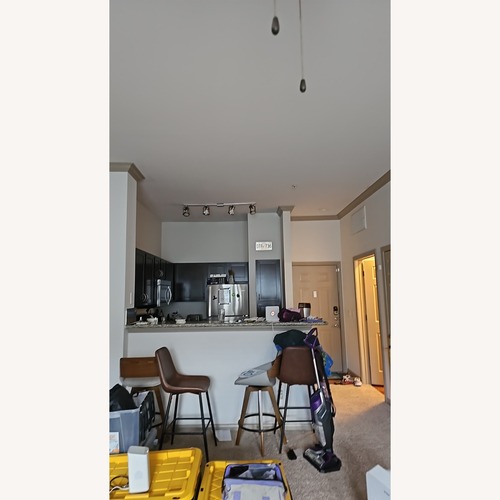 Used Dark Brown Bar Stools (Set of 4) for sale on AptDeco