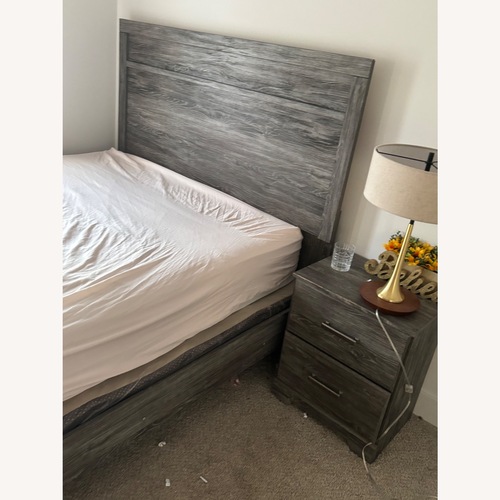 Used Light Brown Wood Queen Bed for sale on AptDeco