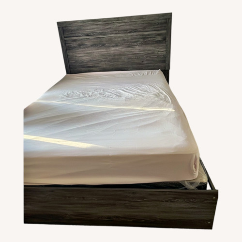 Used Light Brown Wood Queen Bed for sale on AptDeco