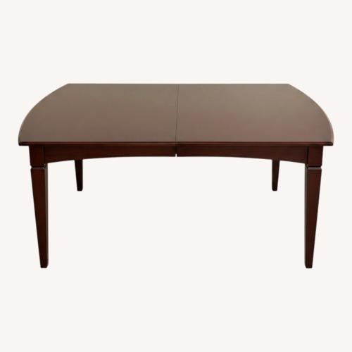 Used Dark Brown Wood Dining Table for sale on AptDeco