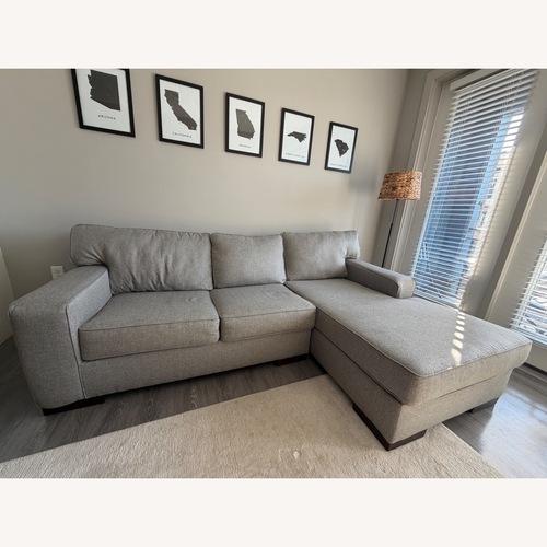 Used Ashley Furniture Home Ashlor Nuvella® 2-Piece Sectional with Chaise for sale on AptDeco