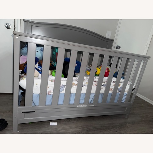 Used Amazon Dark Gray Wood Crib for sale on AptDeco