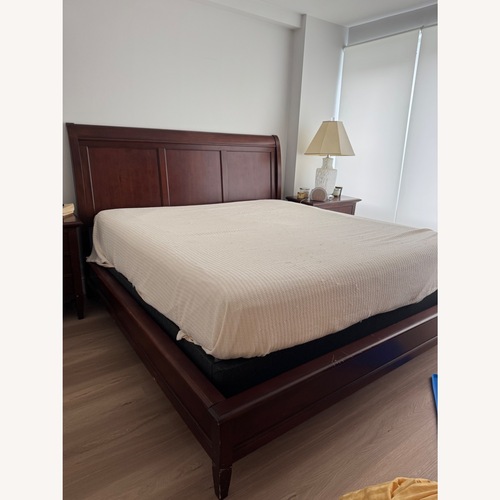Used Dark Brown Wood King Bed for sale on AptDeco