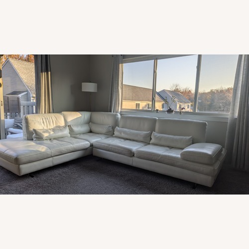 Used White Leather 2 Piece Sectional for sale on AptDeco