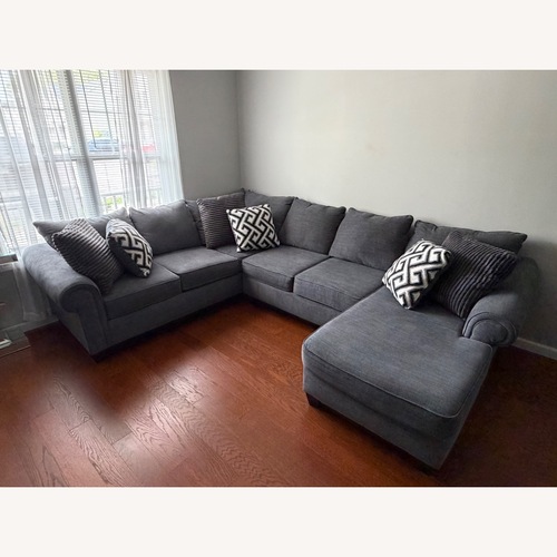 Used Raymour & Flanigan Dark Gray 3+ Piece Sectional for sale on AptDeco
