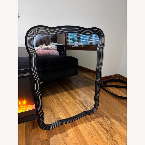 Used Wavy Black Modern Wall Mirror for sale on AptDeco
