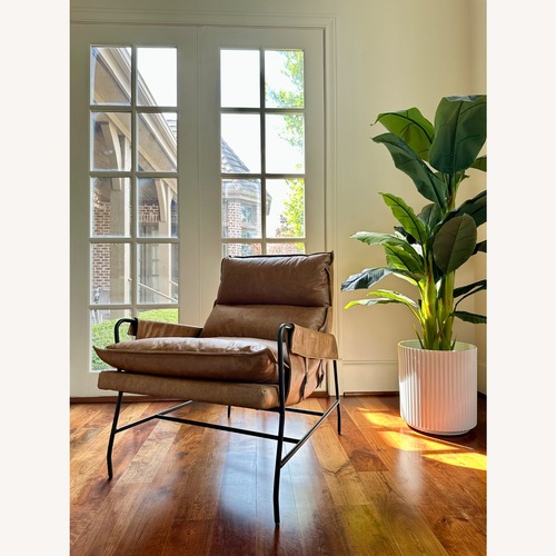 Used Four Hands Light Brown Leather Accent Chair for sale on AptDeco