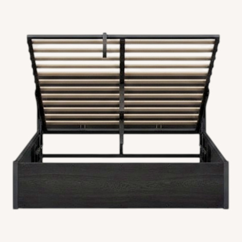 Used Black Wood Lift Up Storage Queen Bed for sale on AptDeco