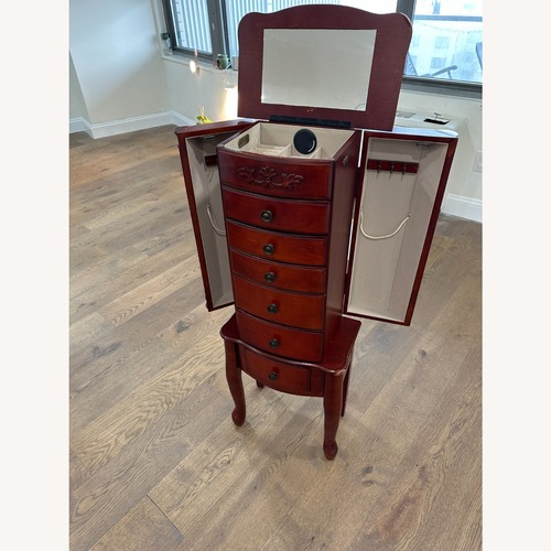 Used  Dark Brown Wood Standing Jewelry Armoire  for sale on AptDeco