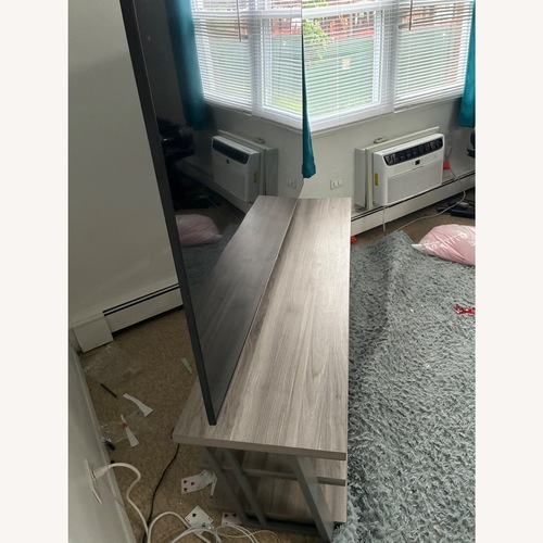 Used Modern Light Gray Swivel TV Stand  for sale on AptDeco