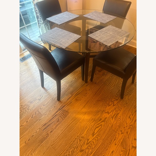 Used Crate & Barrel Halo Glass Dining Table for sale on AptDeco