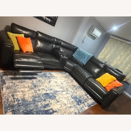 Used Raymour & Flanigan Black Leather Sectional for sale on AptDeco