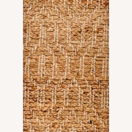 Used Ruby Tribal Natural Jute Rug - by Miss Amara 5' x 7' for sale on AptDeco