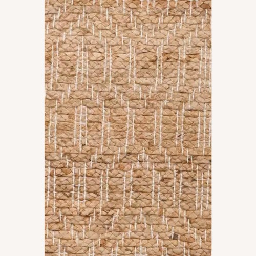 Used Ruby Tribal Natural Jute Rug - by Miss Amara 5' x 7' for sale on AptDeco