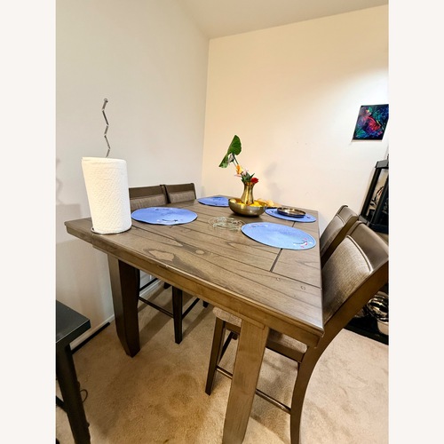 Used Dark Brown Wood Dining Set for sale on AptDeco