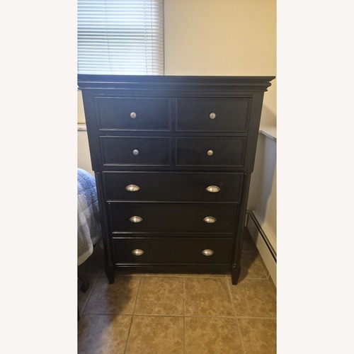 Used Raymour & Flanigan Black Wood Dresser for sale on AptDeco