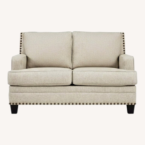 Used Ashley Furniture Claredon Natural Linen Loveseat for sale on AptDeco