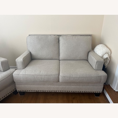 Used Ashley Furniture Claredon Natural Linen Loveseat for sale on AptDeco