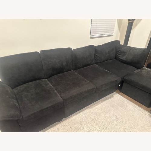 Used Shaped 7 Seat Sectional Sofa with Pull Out Bed for sale on AptDeco