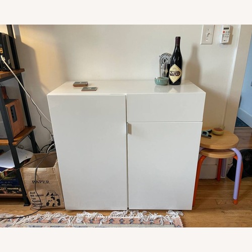 Used CB2 Swig Mini White Lacquer Bar Cart for sale on AptDeco