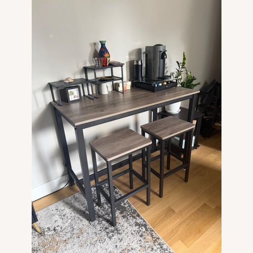 Used Dark Gray Wood Dining Table for sale on AptDeco