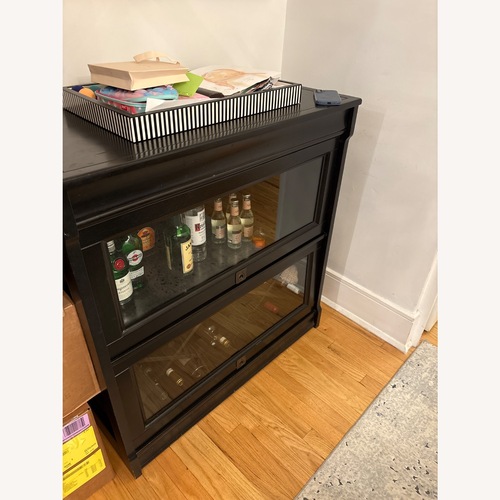 Used  Pottery Barn Solid Wood and Glass Bar Cabinet for sale on AptDeco