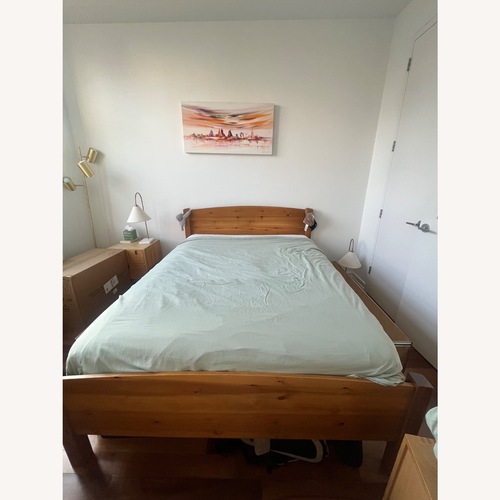 Used Dark Brown Wood Queen Bed With Storage for sale on AptDeco