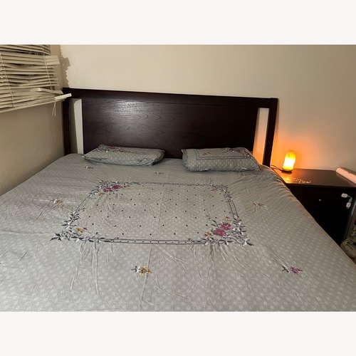 Used Living Spaces Dark Brown Wood King Bed for sale on AptDeco