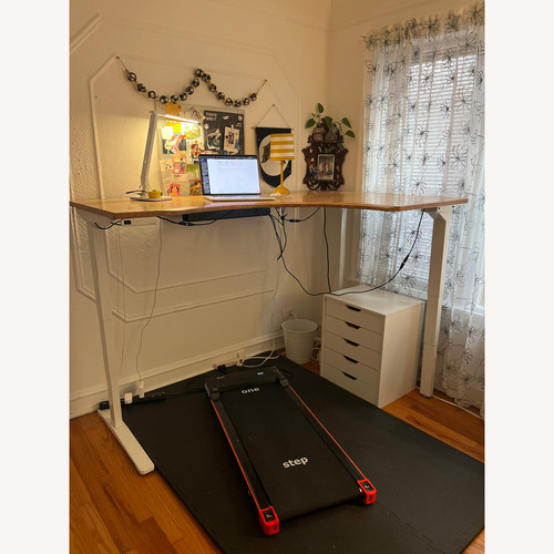 Used L-shaped Uplift Desk Bamboo Desktop for sale on AptDeco
