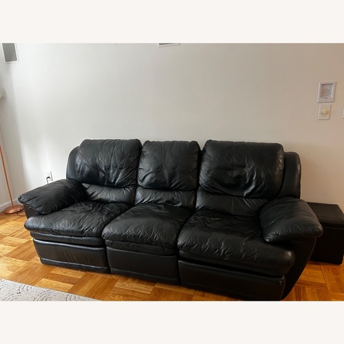 Used Black Leather 2 Piece Sectional for sale on AptDeco